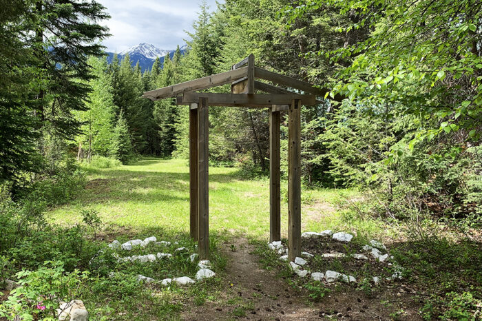 The Cross River arbour at the entrance to the meadow in front of the heritage cabin accommodations